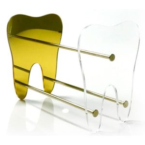 Porta alicates em dourado para organização da clínica odontológica